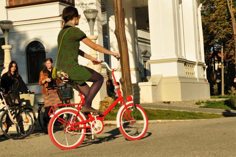 Girl on a red second-hand bike